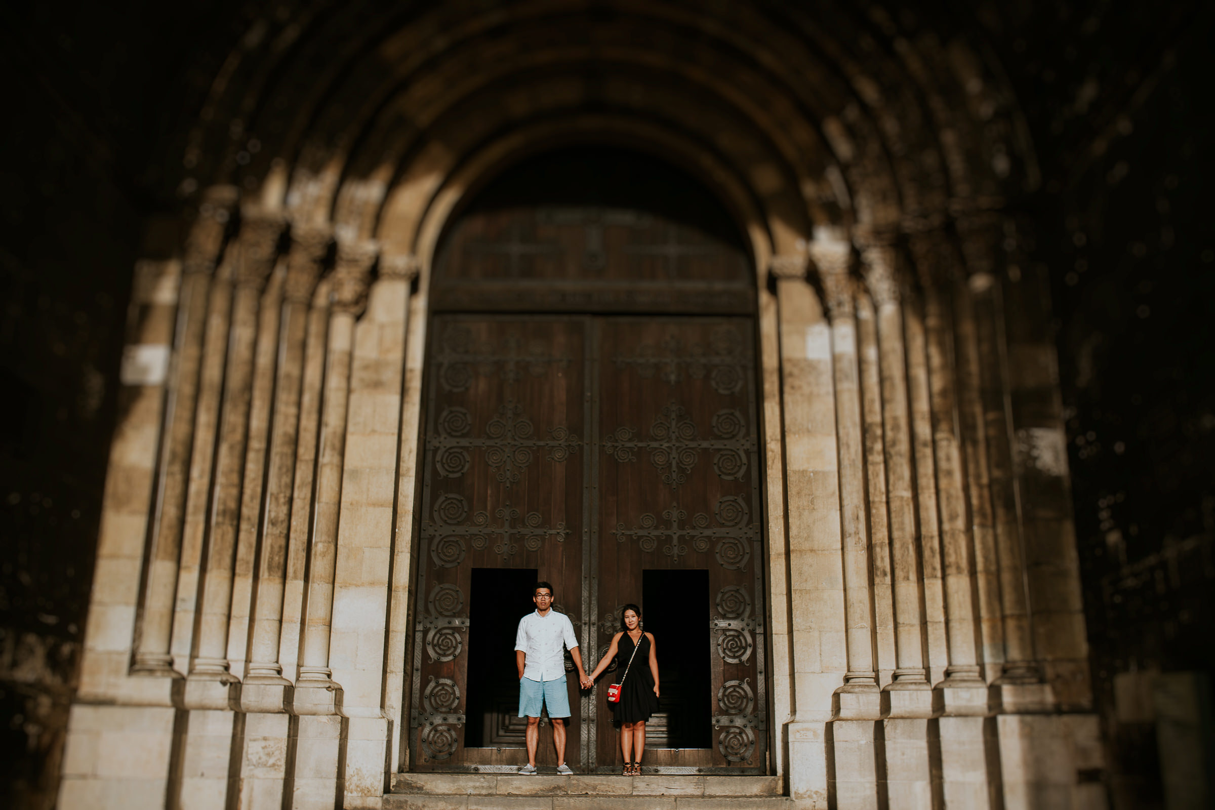 two couple in front of a church in lisbon