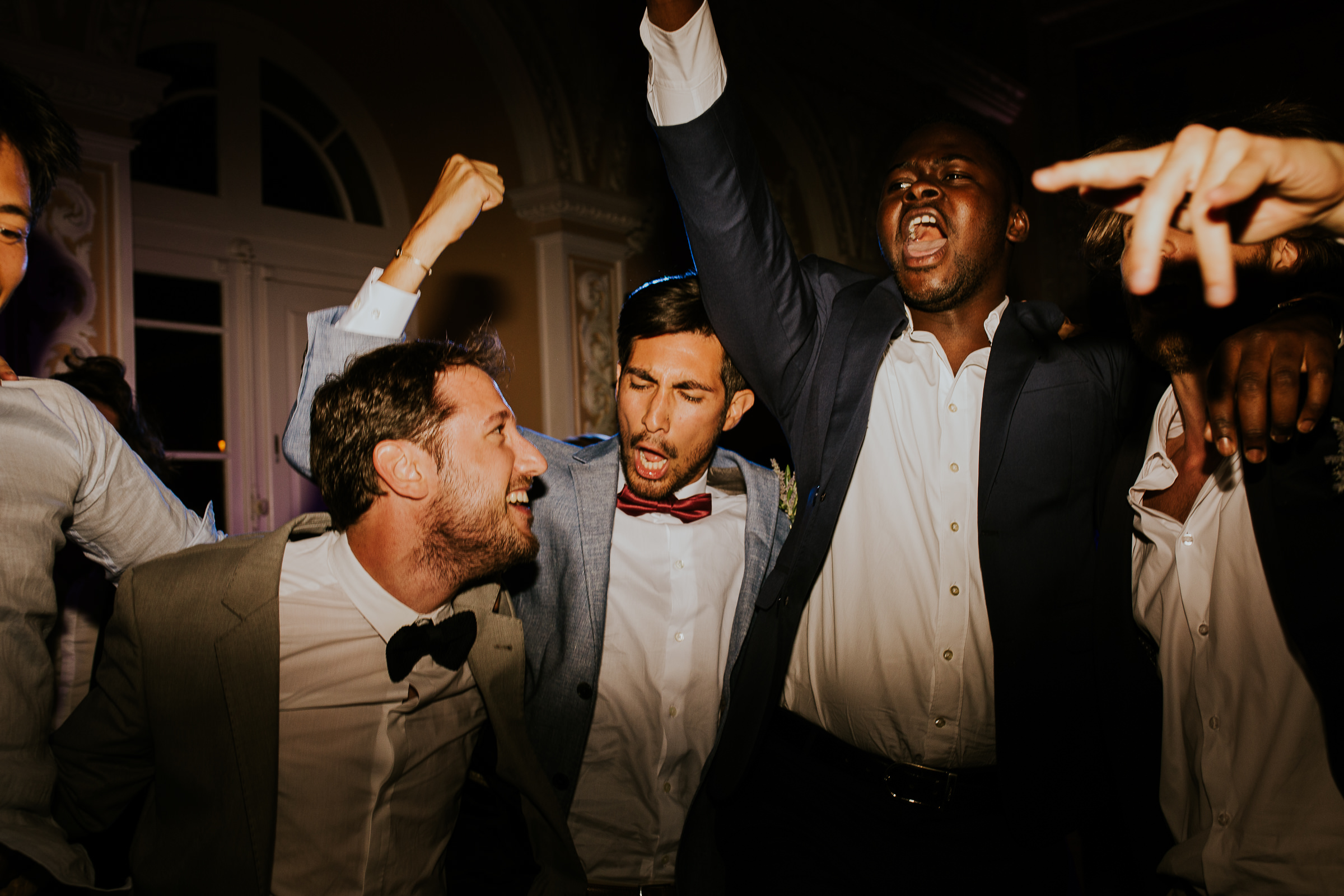 Guys partying hard in a wedding